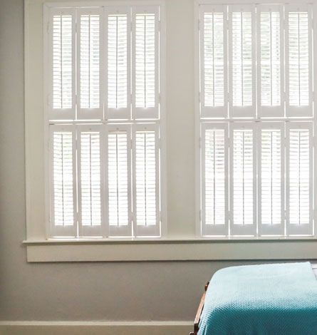 White Shutters on Two Windows, With a Teal Bed — GV Blinds in Shepparton, VIC