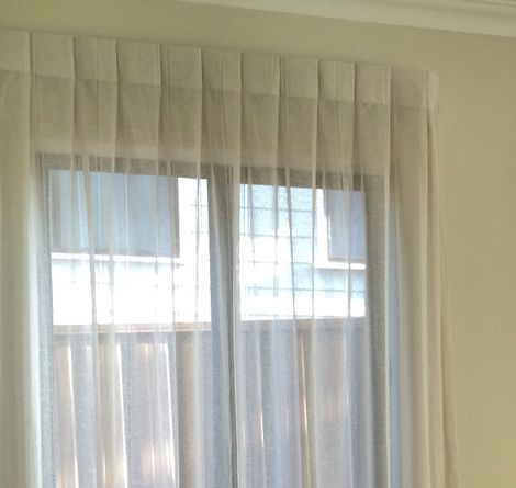 Sheer Cream Curtains Hang Over a Window, Letting in Sunlight — GV Blinds in Shepparton, VIC