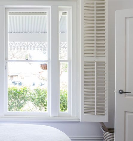 White Window With Blinds, Shutters, and a View of Greenery — GV Blinds in Shepparton, VIC