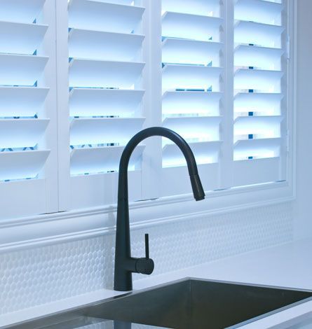 Black Faucet Over Stainless Steel Sink; White Shutters in Background — GV Blinds in Shepparton, VIC