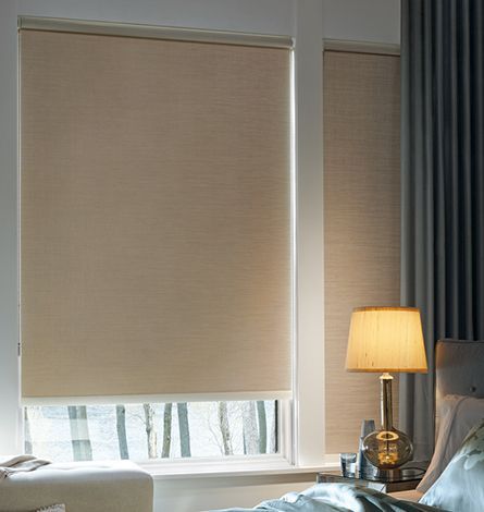 Beige Roller Shade in a Window, Lamp on a Nightstand — GV Blinds in Shepparton, VIC