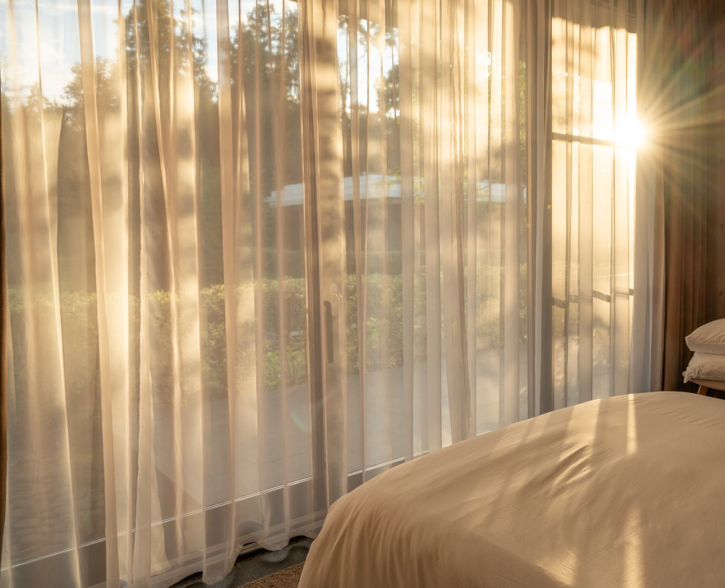 Sheer Curtains in Bedroom with Sunlight Shining Through — GV Blinds in Wangaratta, VIC