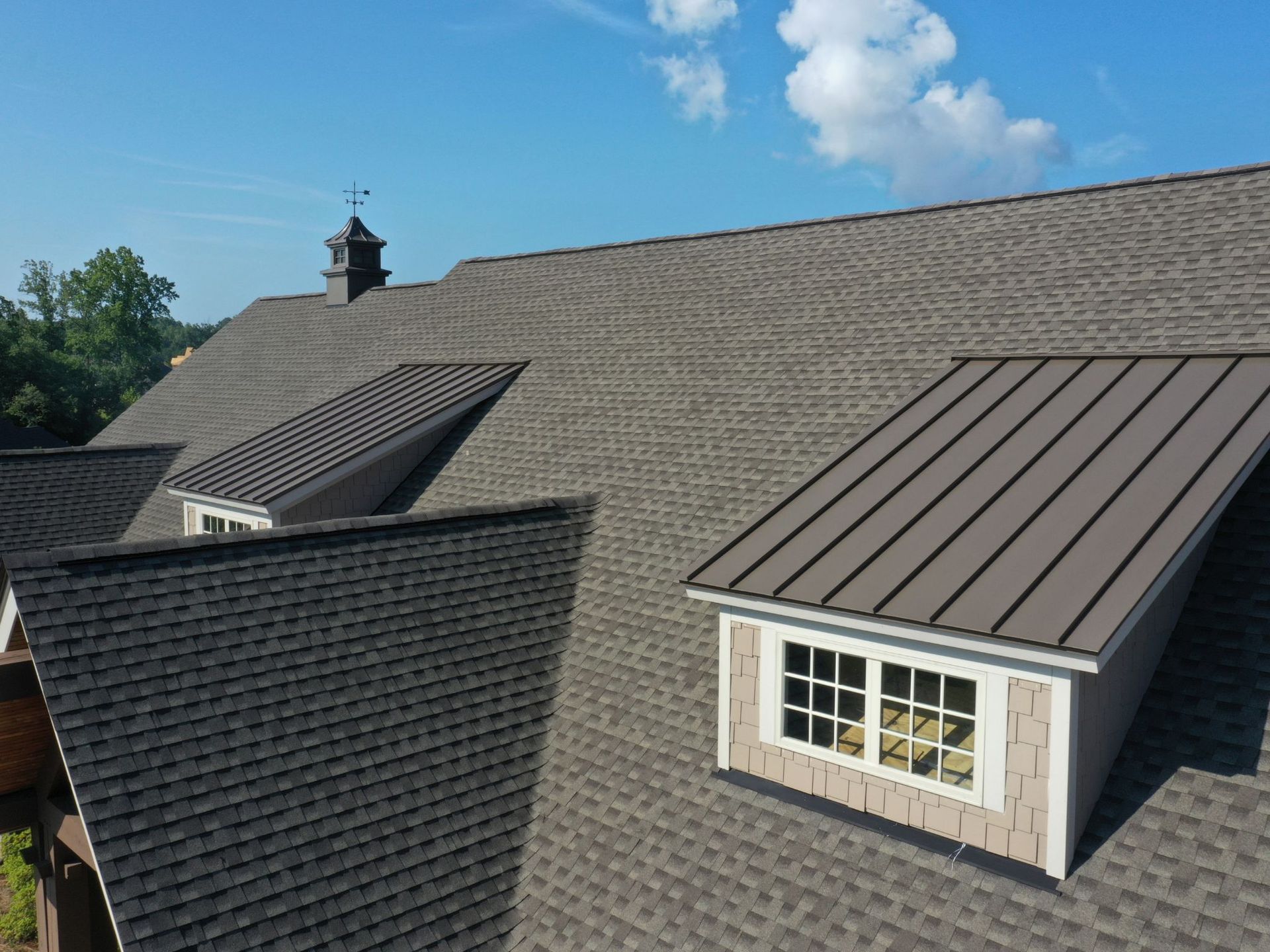 An aerial view of a house with a roof and a window