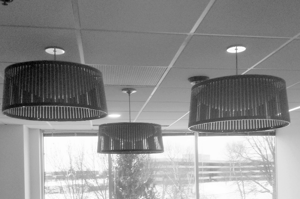 Two lamps are hanging from the ceiling in a room
