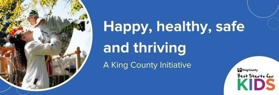 Woman holding up a child against a backdrop of green trees. Text on a blue background: Happy, healthy, safe and thriving.