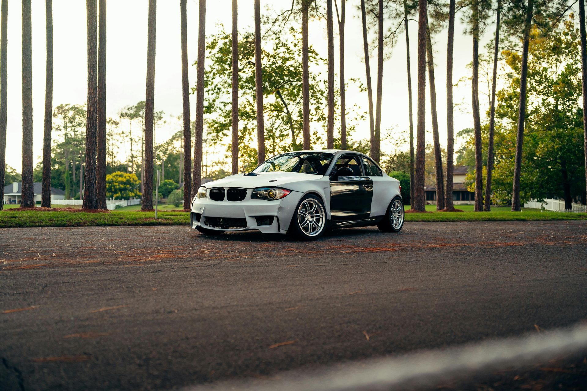 White Car Parked Along Scenic Forest Road | Brady’s Auto Repair