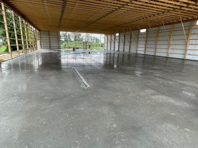 A large concrete floor in a building under construction.