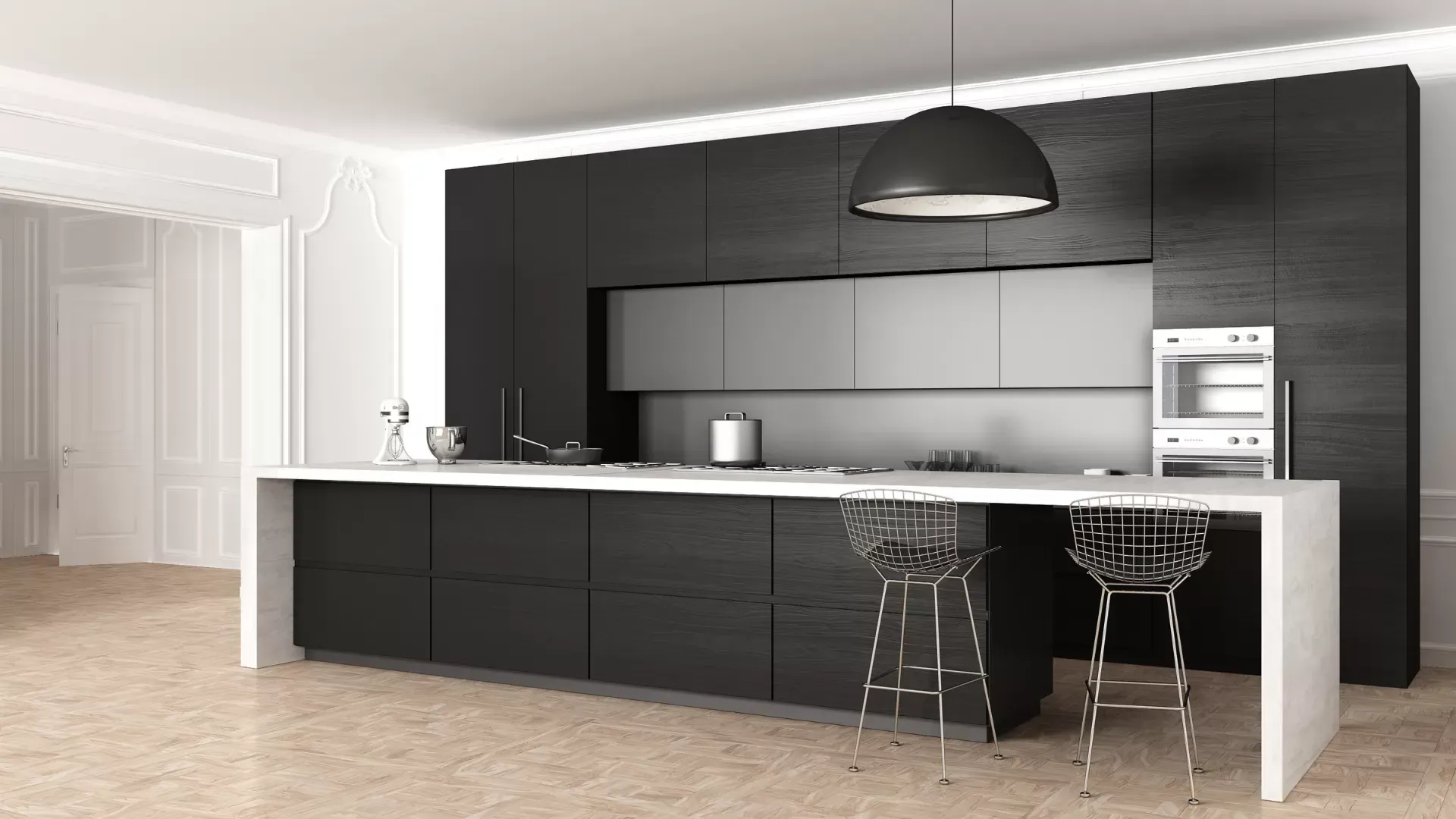 Cucina moderna in bianco e nero con isola, sgabelli da bar ed elettrodomestici a incasso.
