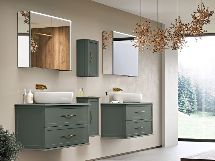 Bagno moderno con due lavabi verdi, specchi e un'ampia finestra.