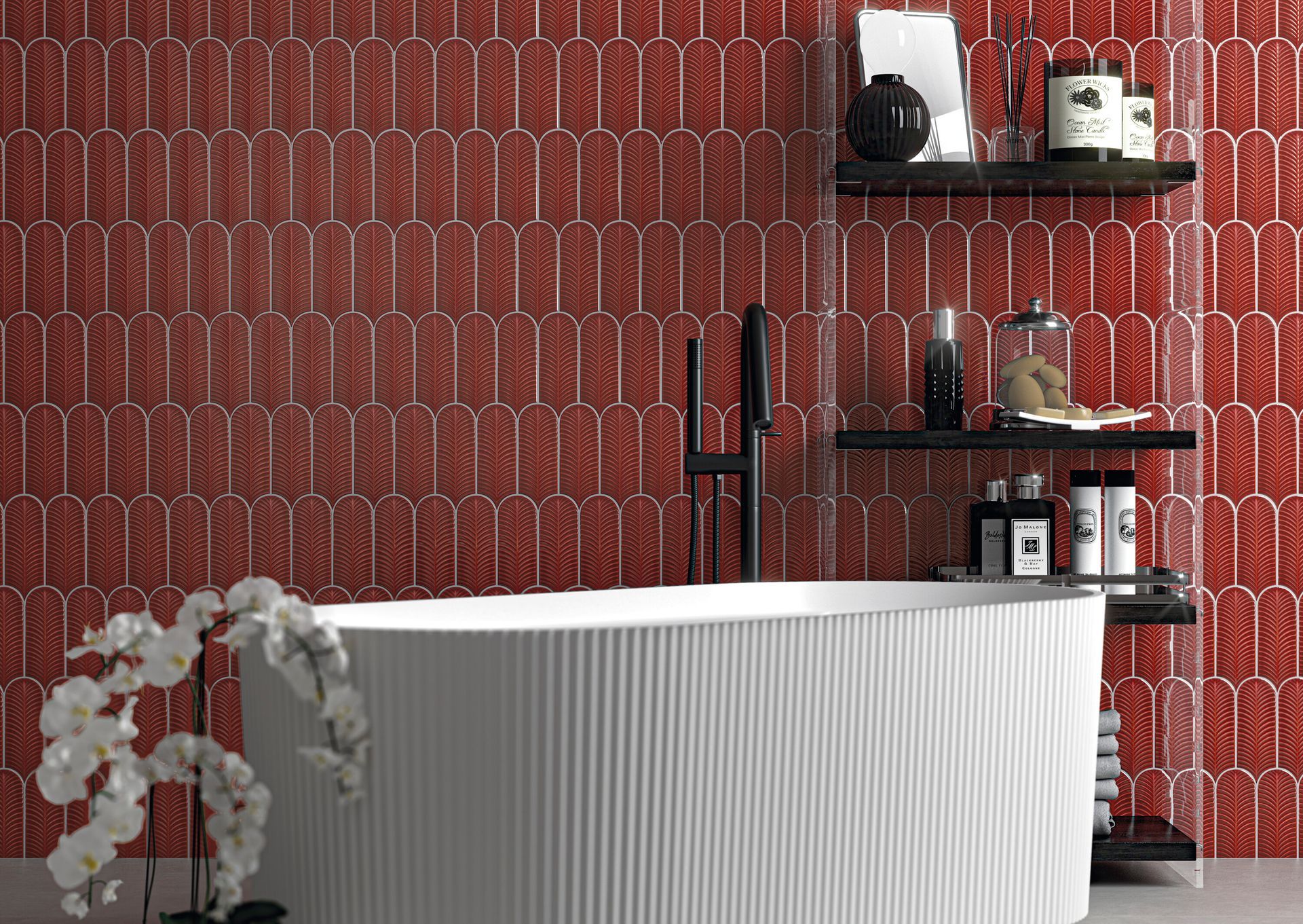 Bagno moderno con piastrelle rosse decorate, mobile lavabo bianco, mensole nere e orchidee.