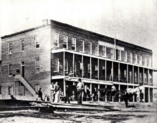 A black and white photo of a large brick building