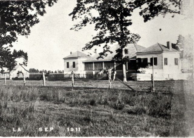 A black and white photo of a house dated september 1911