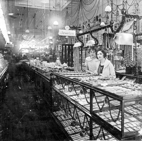 A black and white photo of a jewelry store