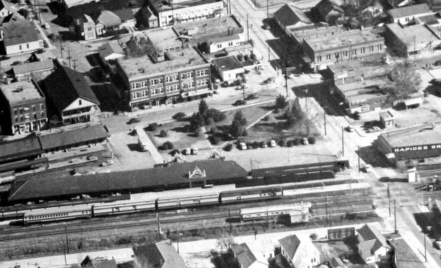 An aerial view of a train station in a small town