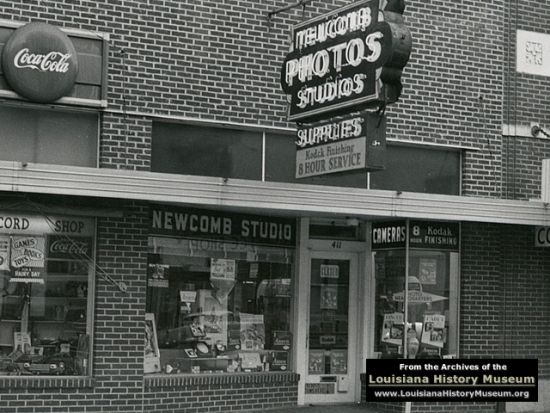 A black and white photo of the newcomb studio