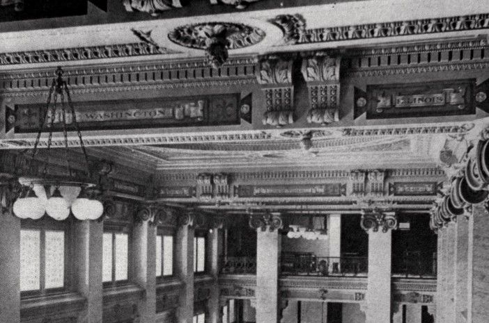 A black and white photo of the ceiling of a building