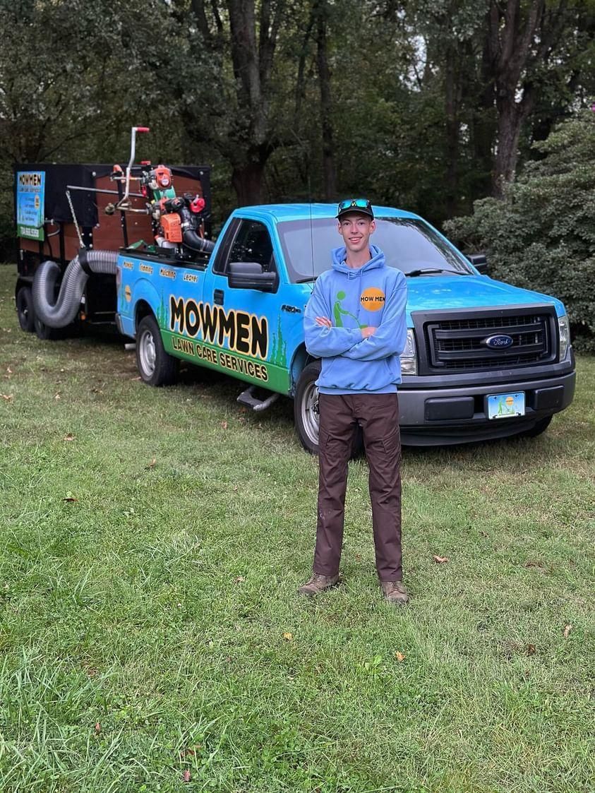 the owner of Mowmen with work truck