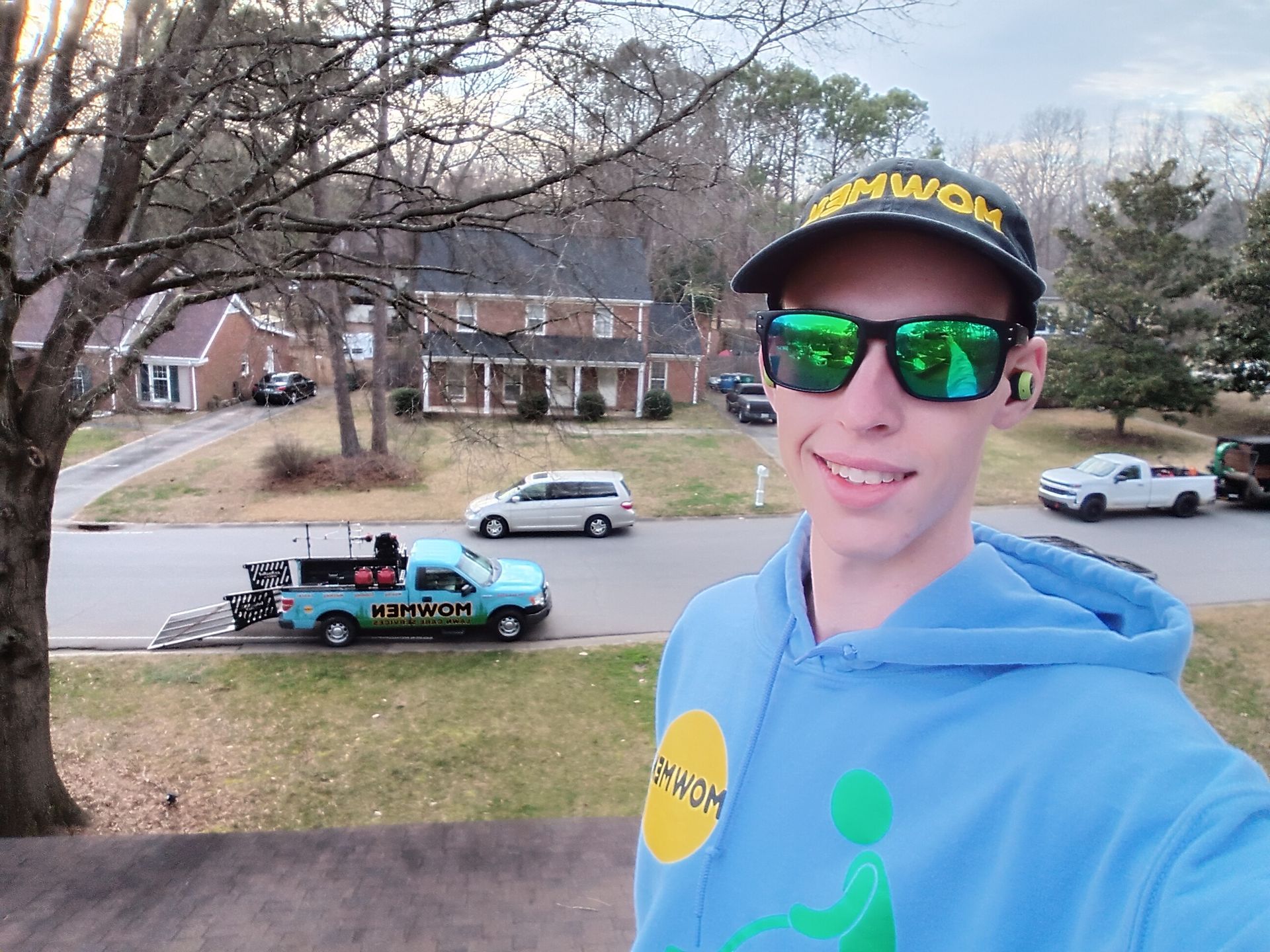 a man wearing sunglasses and a hat with the word wow on it
