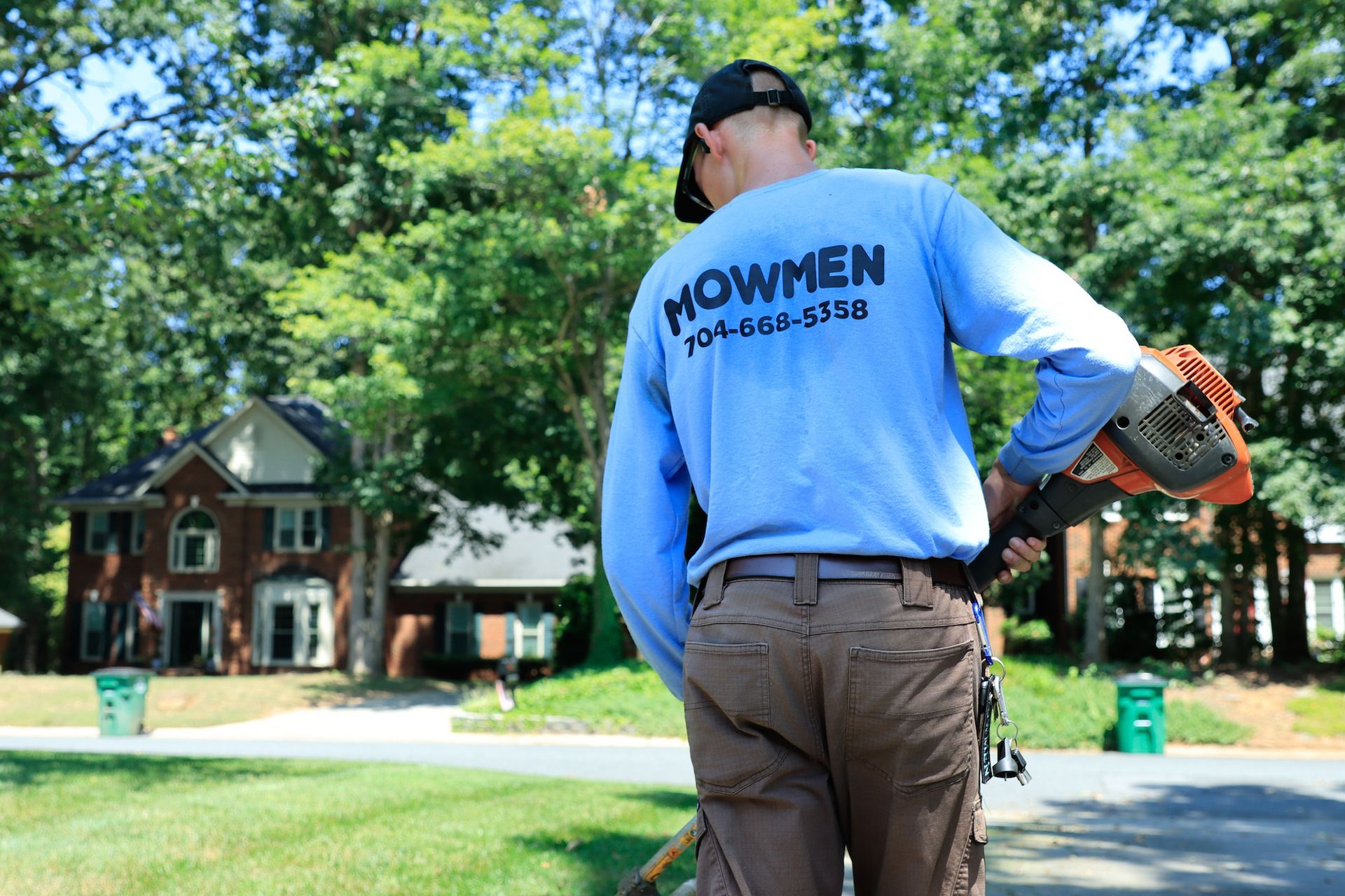 Employee edging residential property. 