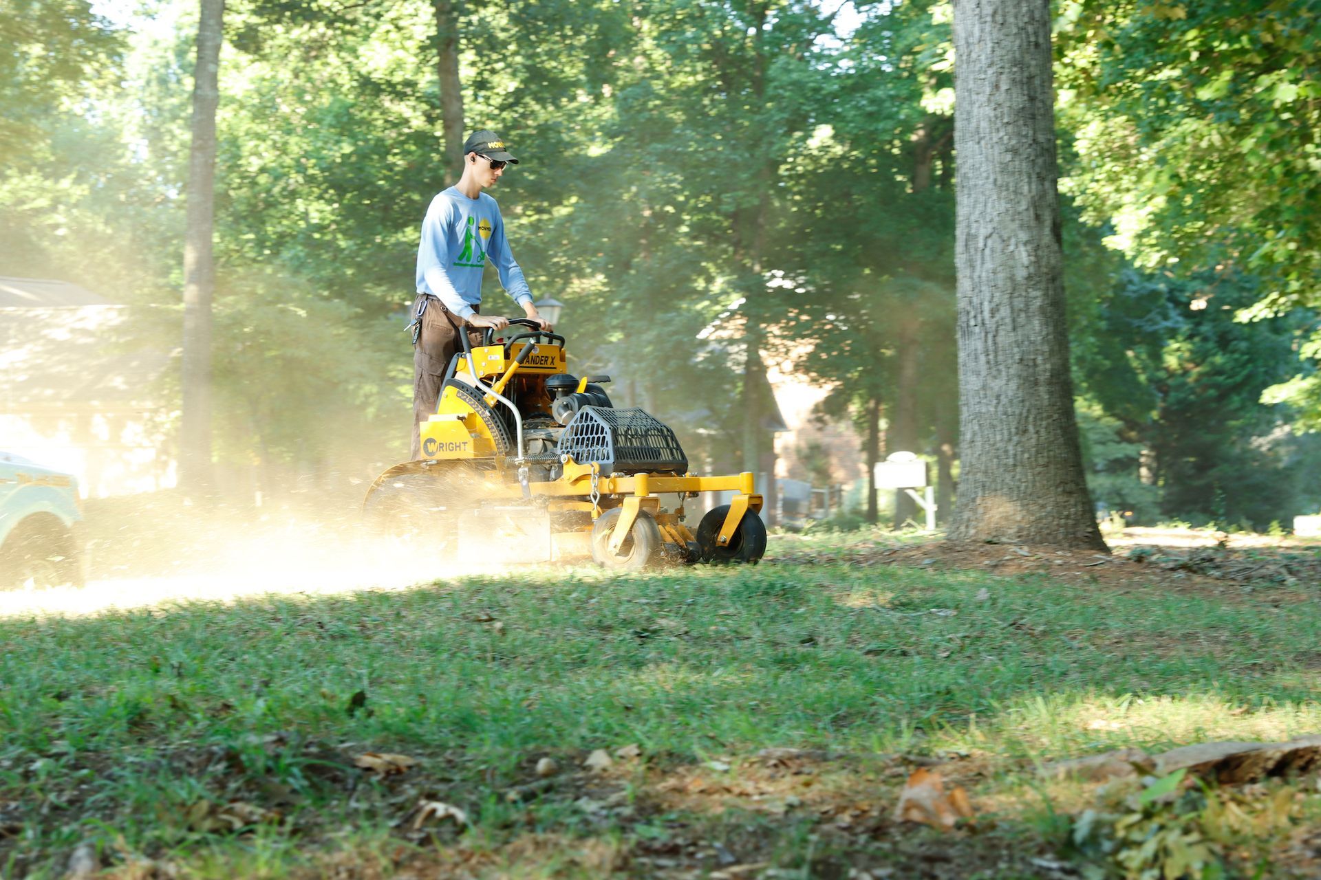 employee blowing debris
