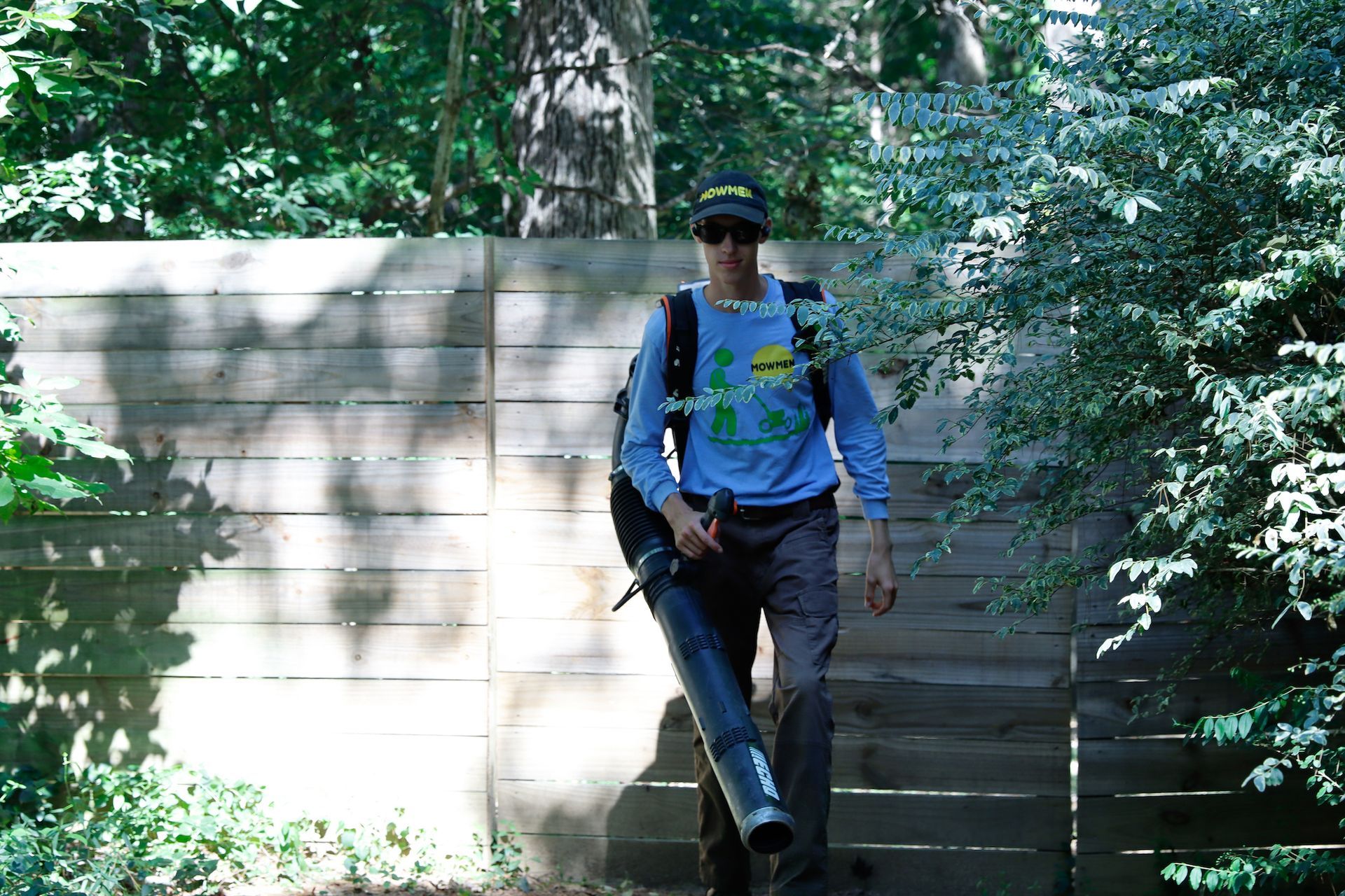 employee edging around bushes