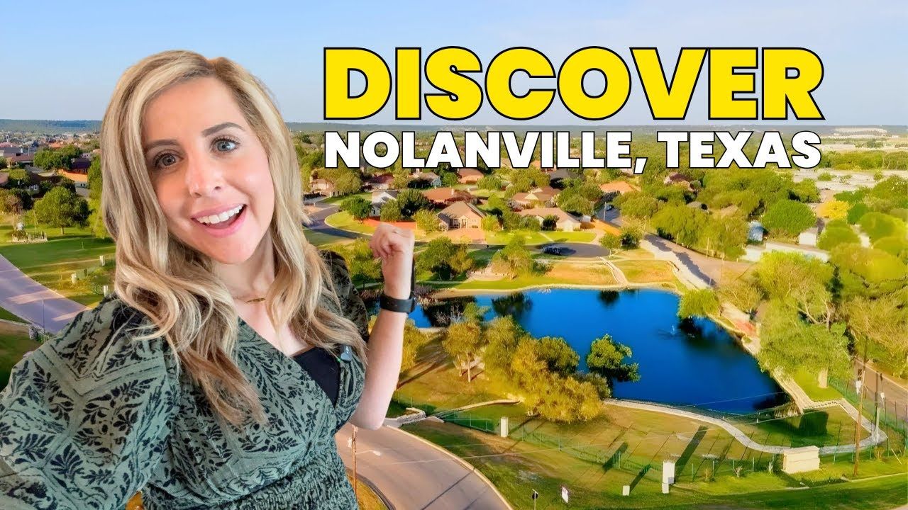 Woman points toward Nolanville, Texas, aerial view. Green dress, yellow text, pond and green landscape.