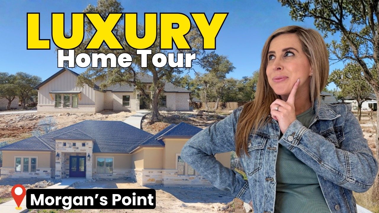 Woman in jean jacket gestures near luxury home exteriors in Morgan's Point, Texas.