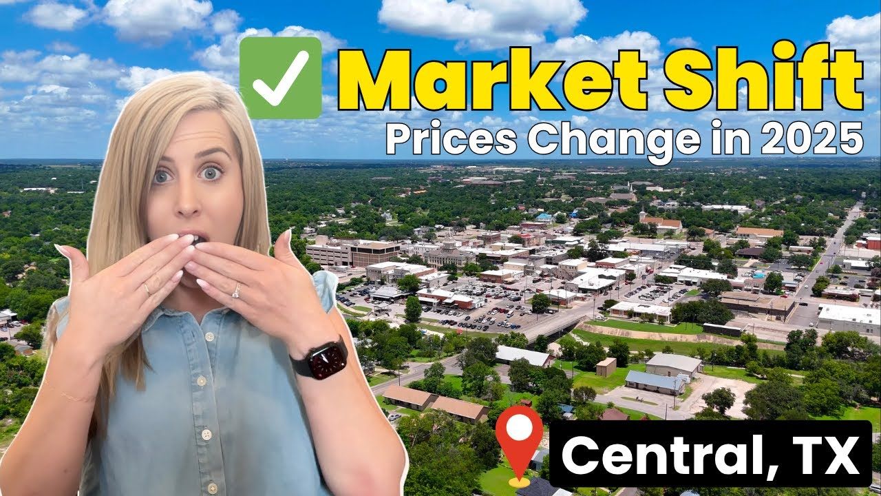 A woman is covering her mouth in front of an aerial view of a city.