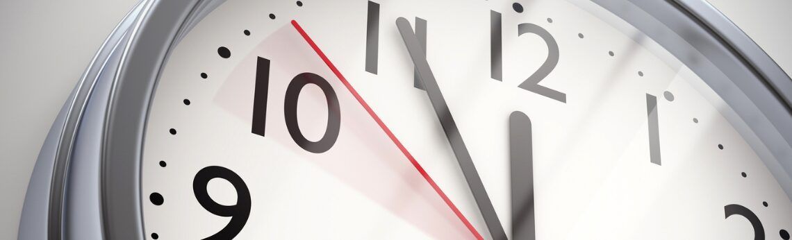 Clock face showing the time is approximately 10:55, the red second hand is moving.