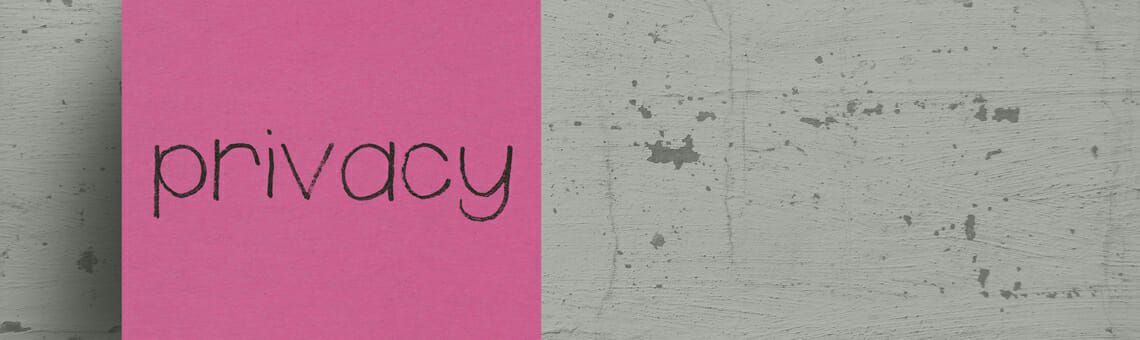 A pink sticky note with the word 