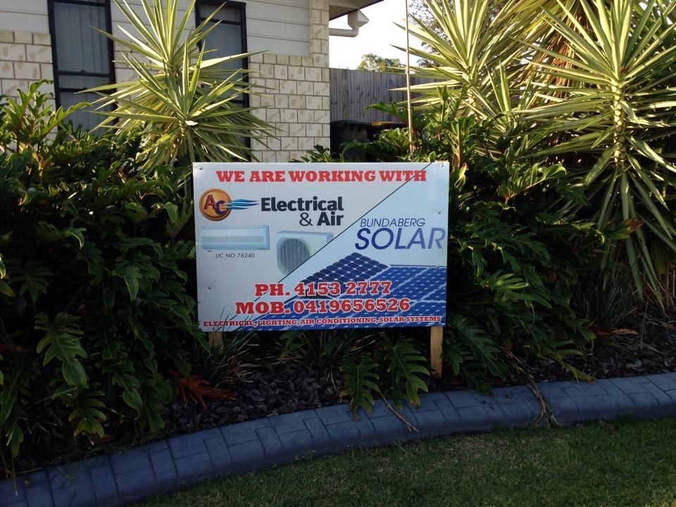An aerial view of a building with solar panels on the roof — AC Electrical & Air In Bundaberg Central, QLD