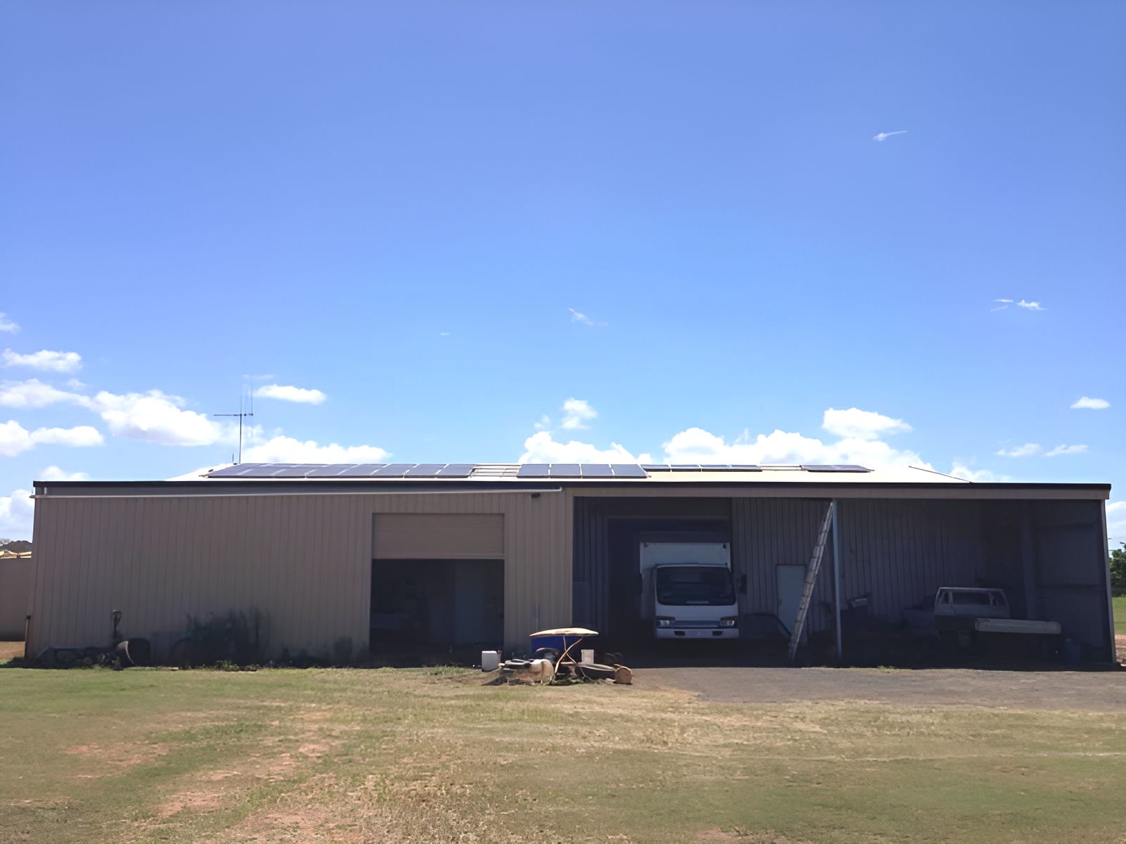 A large building with a picnic table in front of it — AC Electrical & Air In Bundaberg Central, QLD