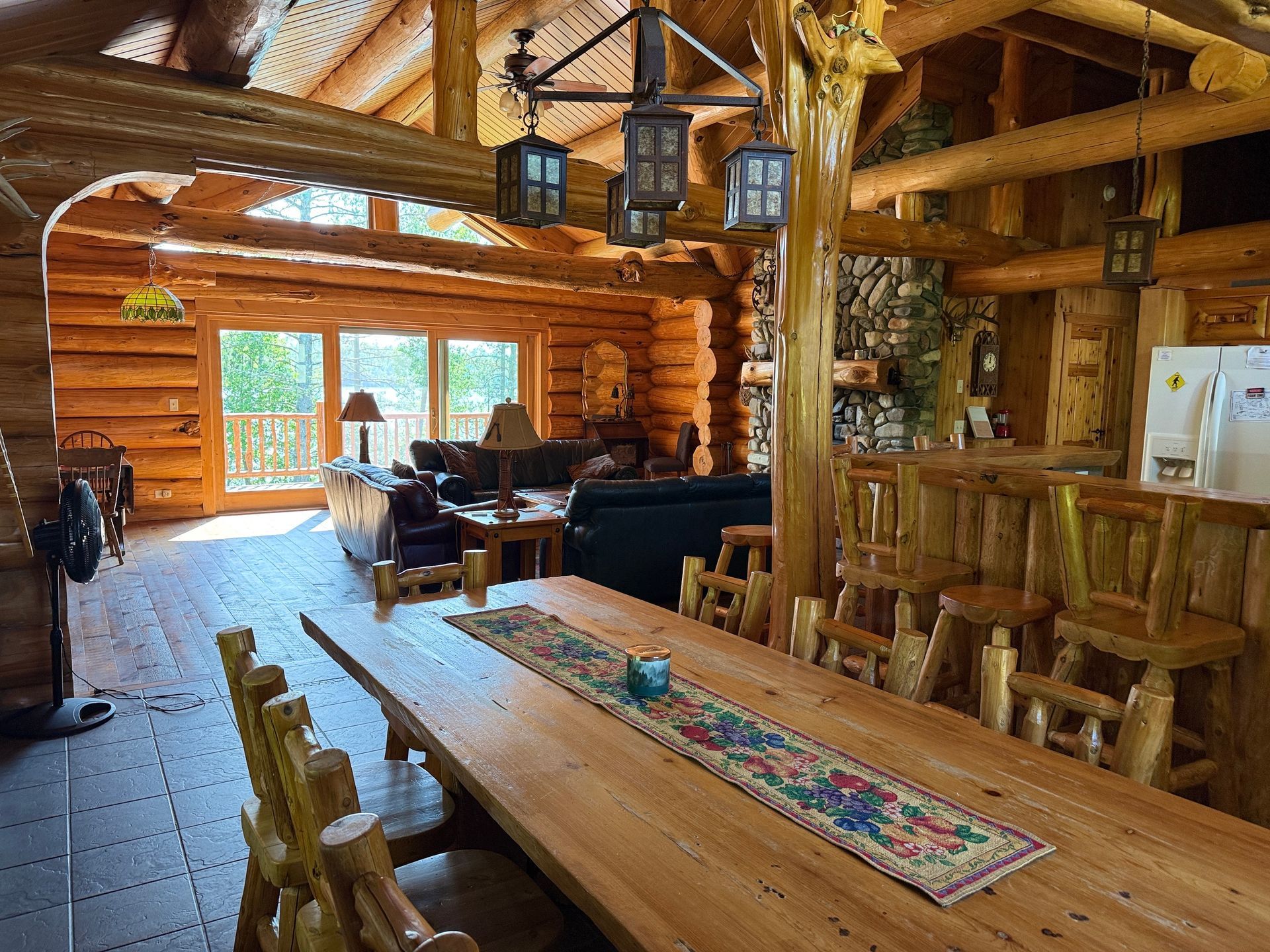 There is a long wooden table in the middle of the room.