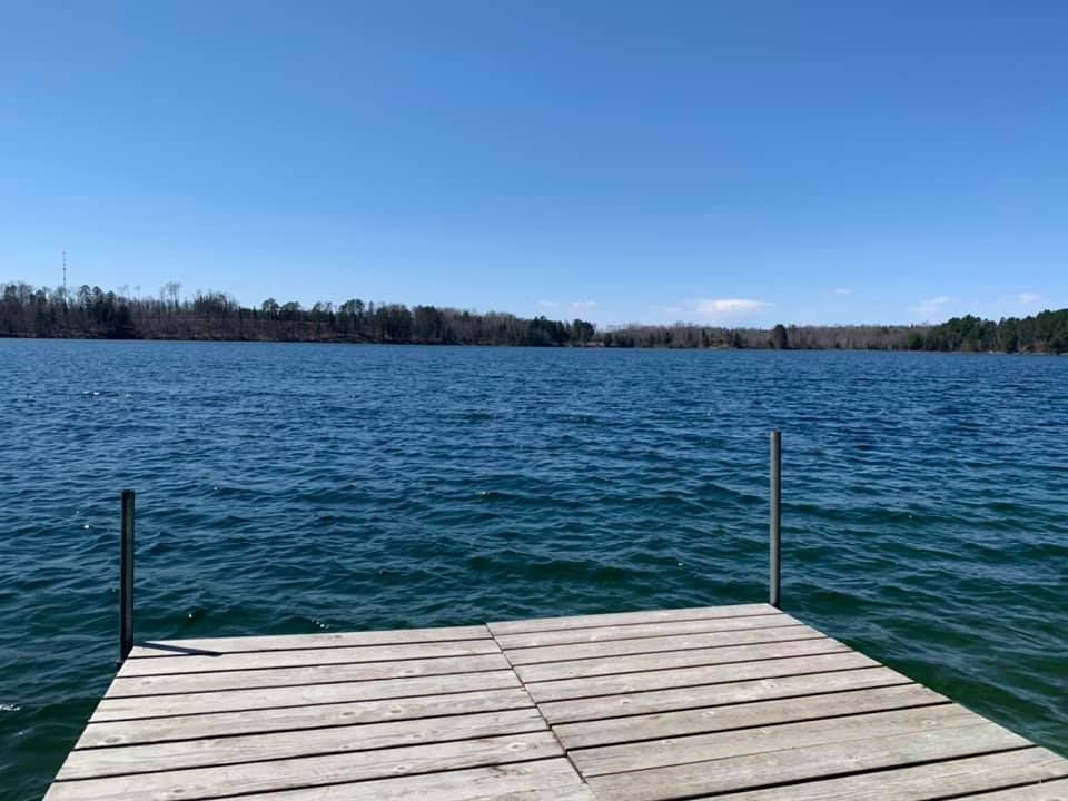 A wooden dock overlooking a large body of water.