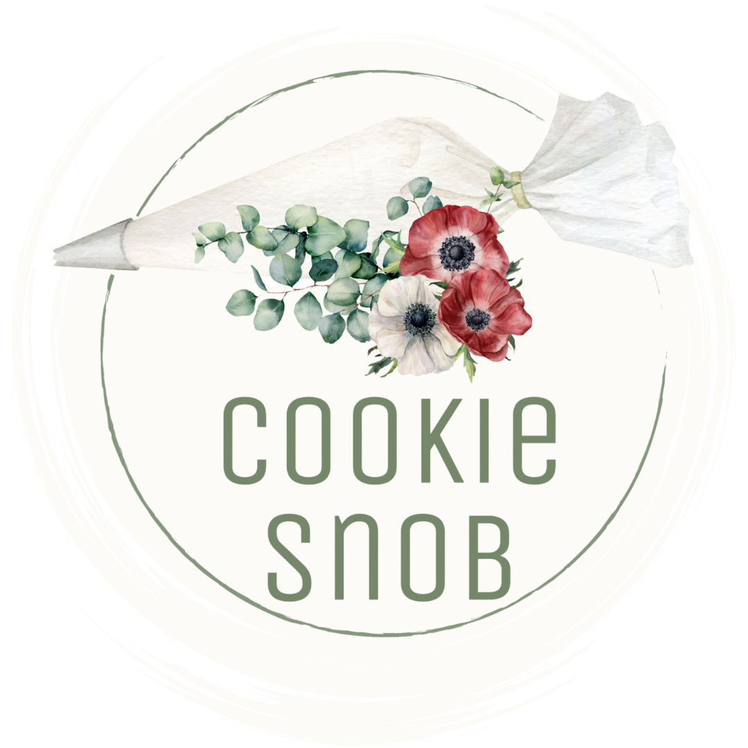 A cookie snob logo with a piping bag and flowers