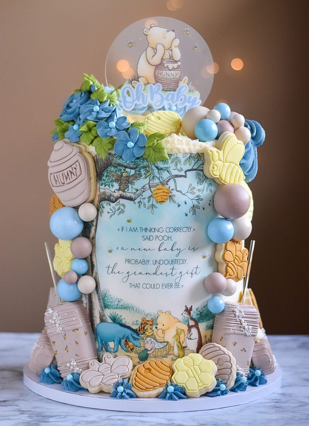 A cake with a picture of winnie the pooh on it is sitting on a table.