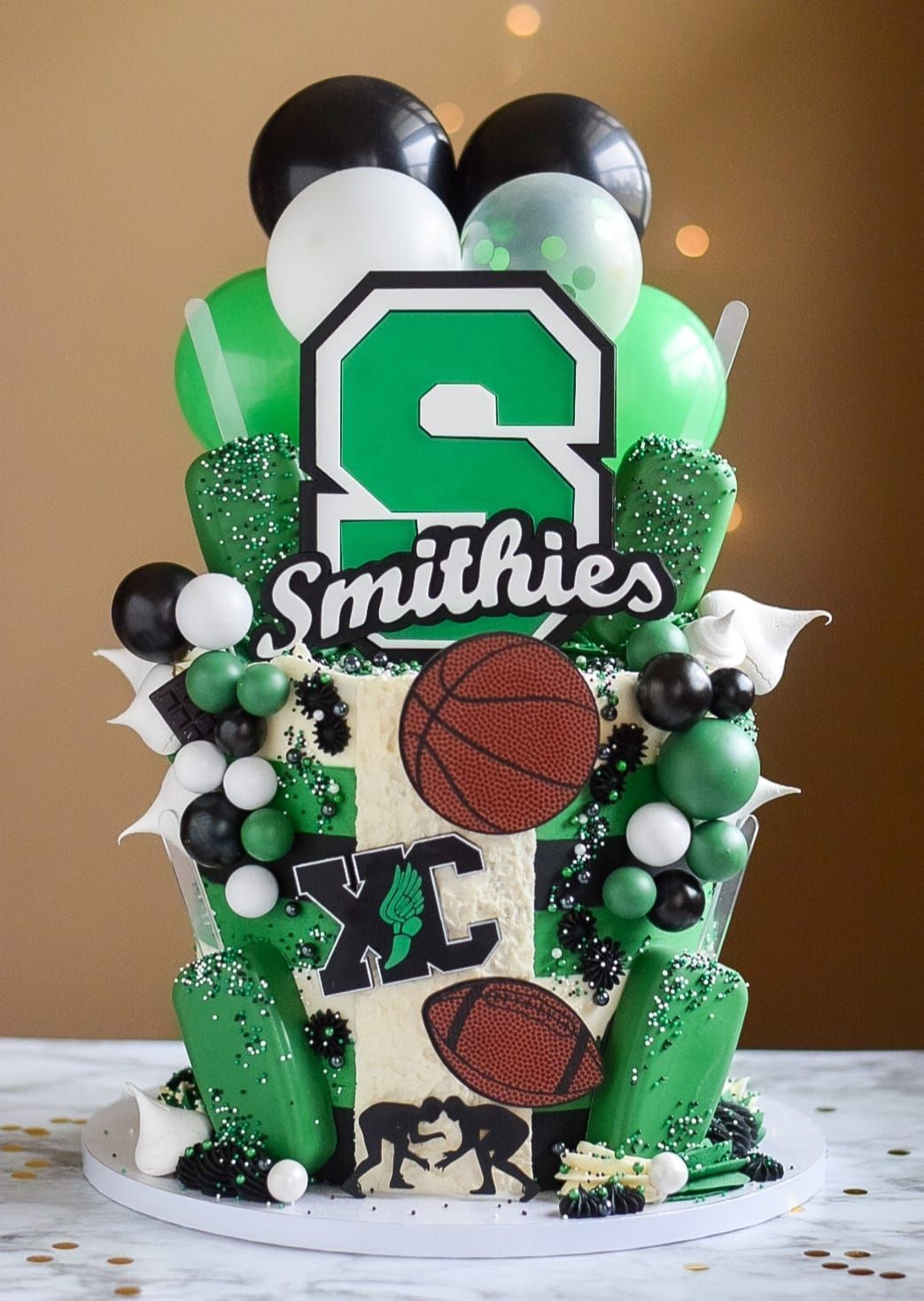 A cake with the name smithies on it