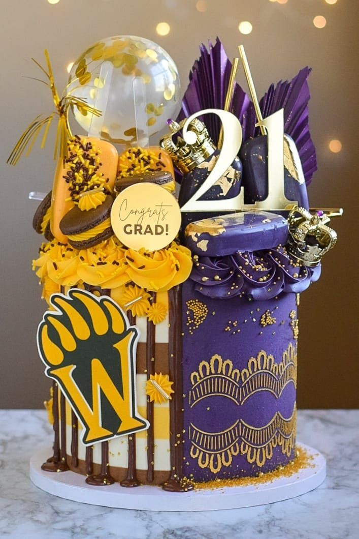 A purple and yellow cake is sitting on top of a table.
