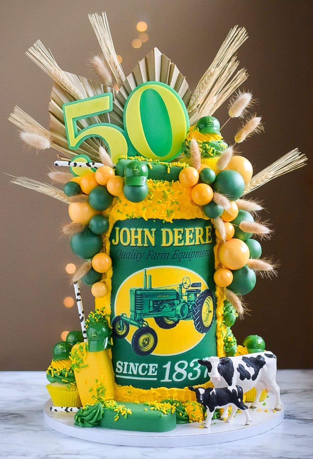 A cake with a picture of a john deere tractor on it.