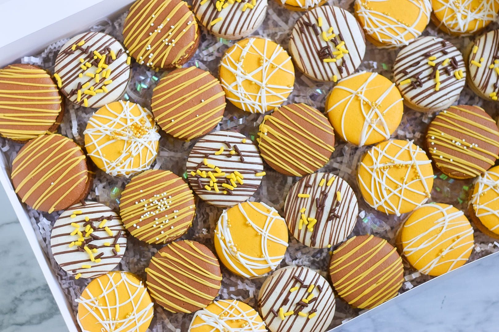 A box filled with lots of different types of cookies.