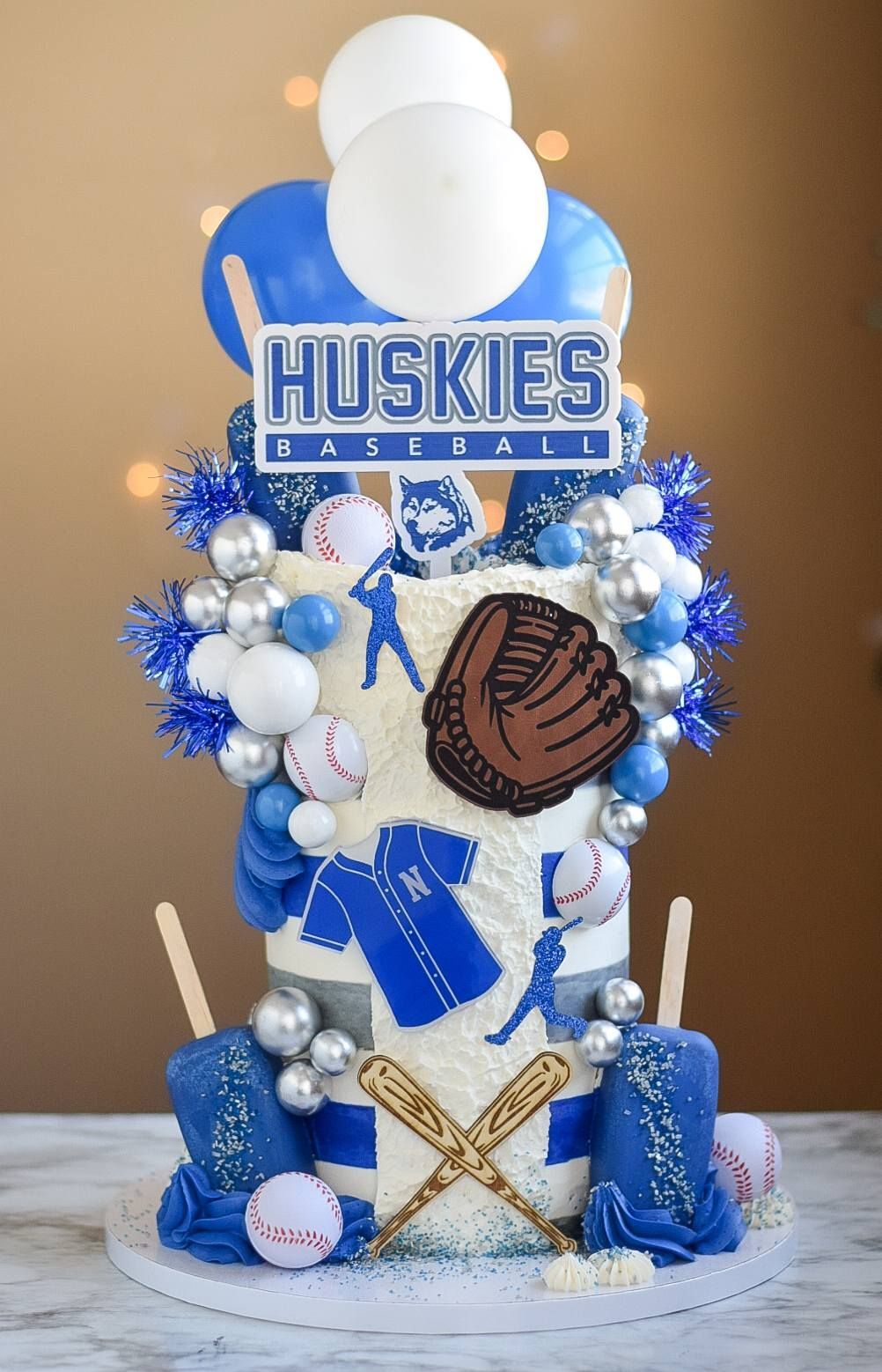A huskies baseball cake is sitting on top of a table.