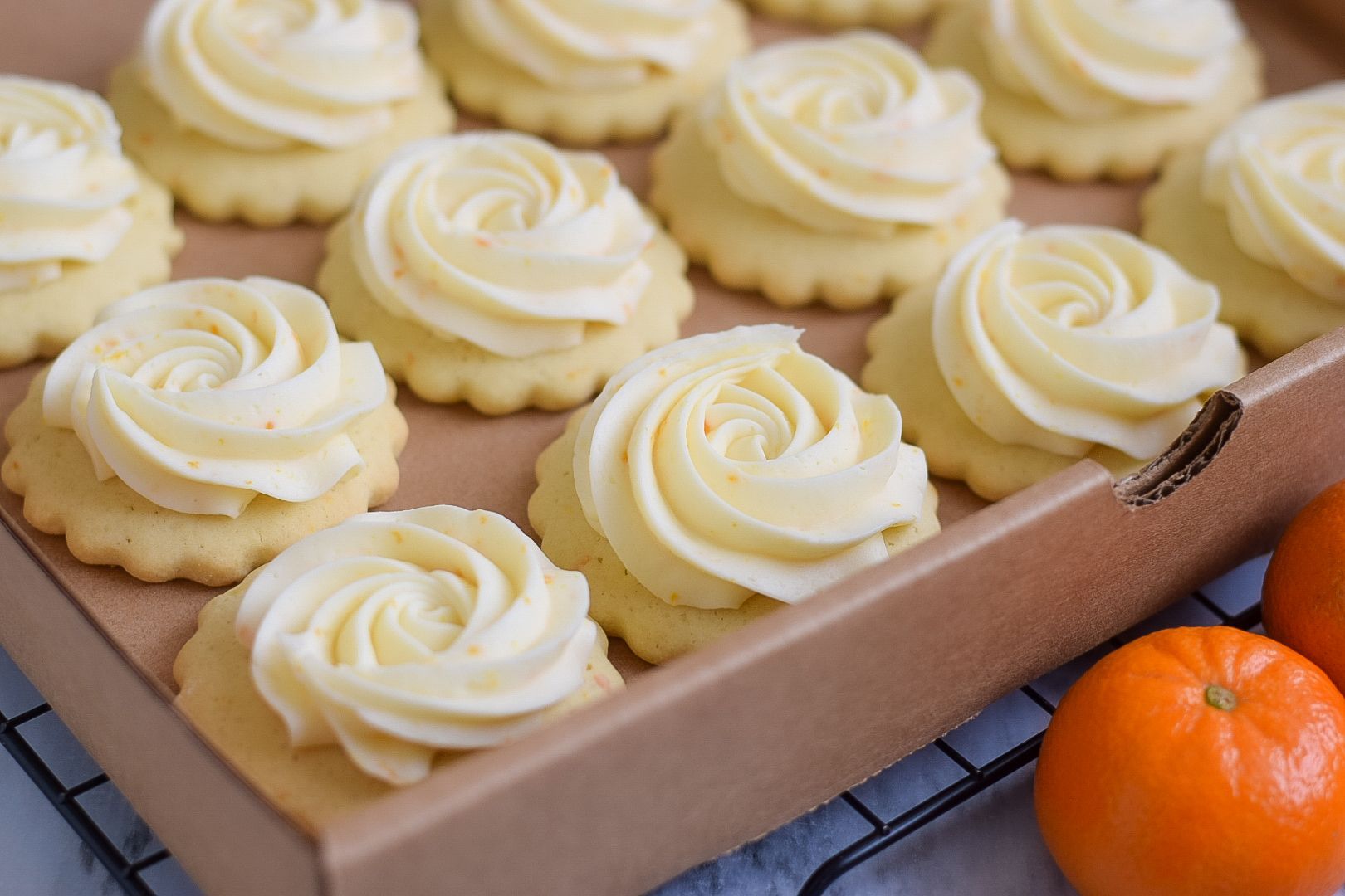 Autumn-themed frosted sugar cookies: apple, pumpkin, and round shapes, decorated with colorful frosting and sprinkles.