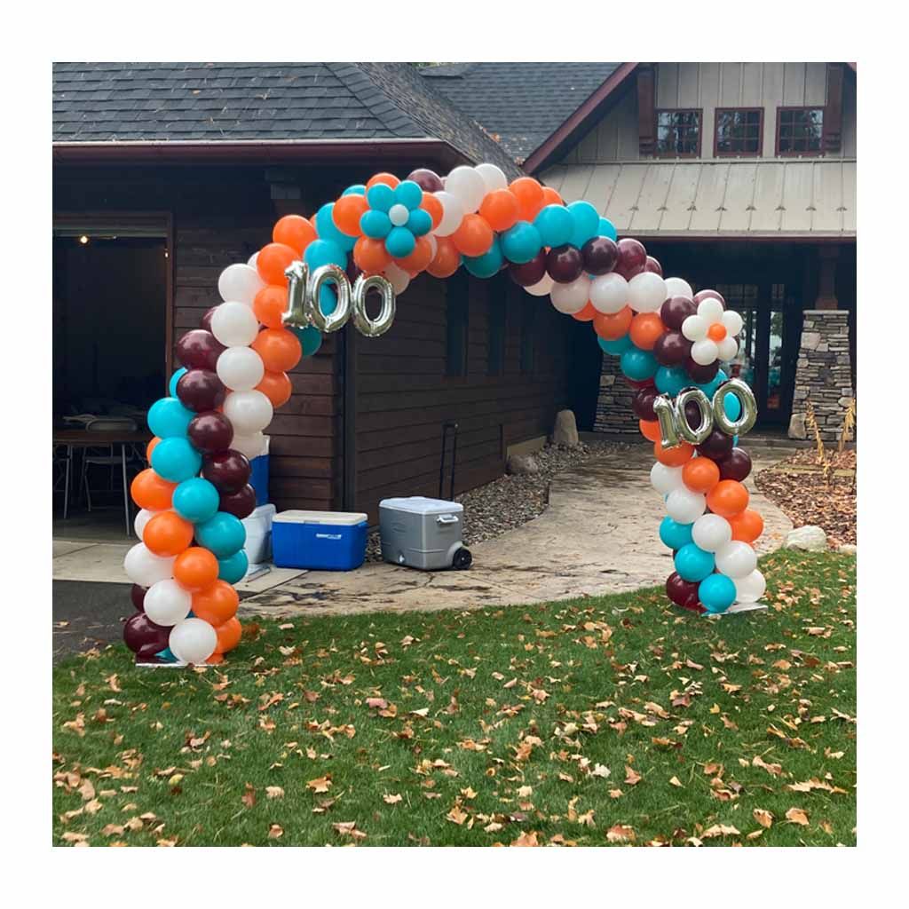 A balloon arch with the number 100 on it