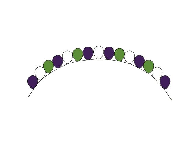 A bunch of green and purple beads on a white background.