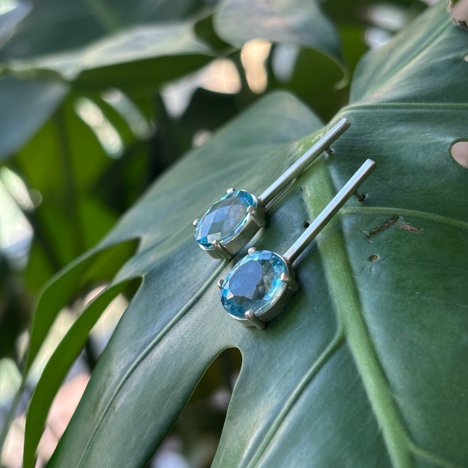 Oval Blue Topaz Stud Earrings in sterling silver