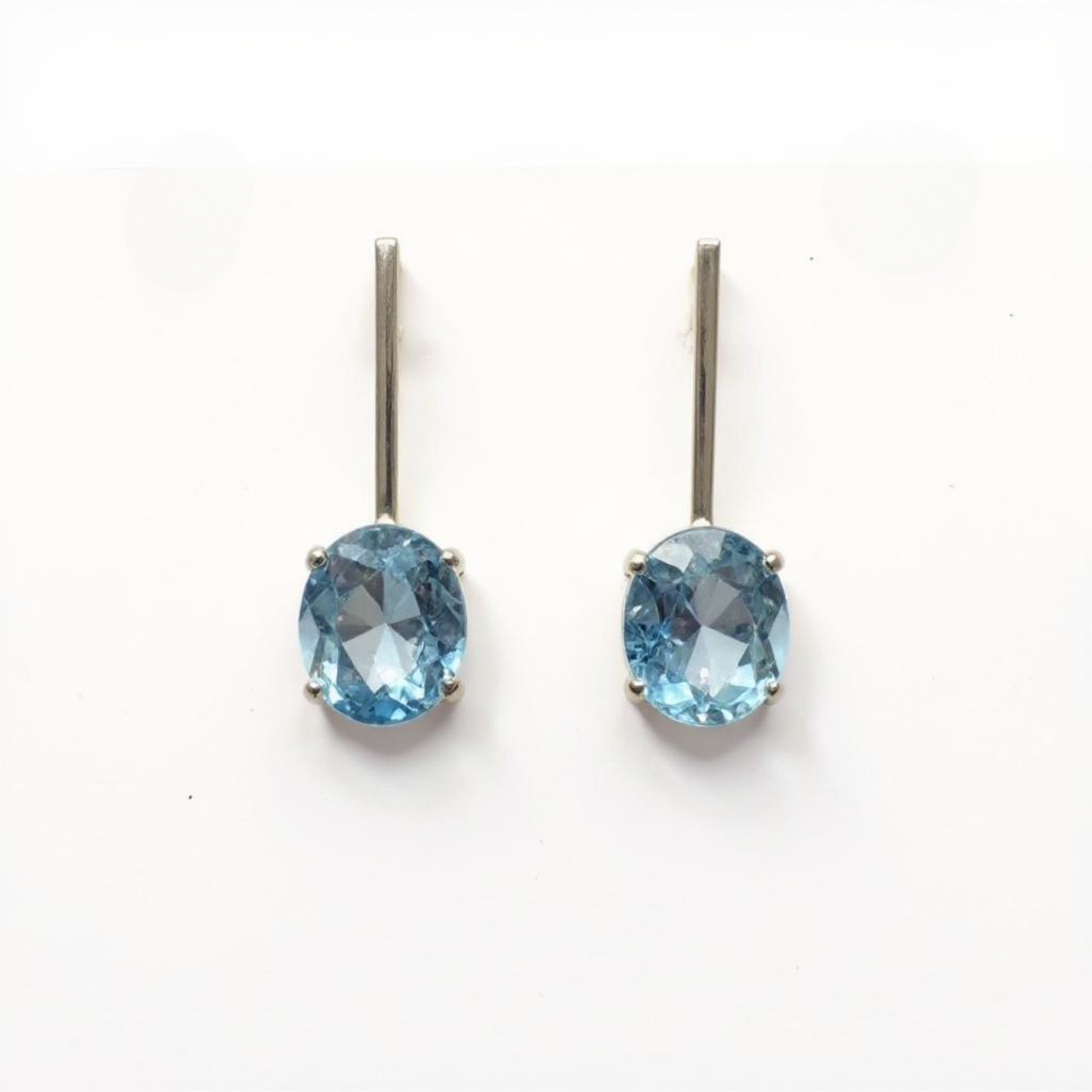 Oval Blue Topaz Stud Earrings in sterling silver