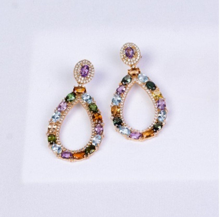 Gold plated statement earrings featuring amethyst (purple gemstones) surrounded by zirconia (clear gemstones), imperial topaz (golden-pink gemstones), tourmaline, blue and yellow topaz (golden gemstones), and garnet (red gemstones)