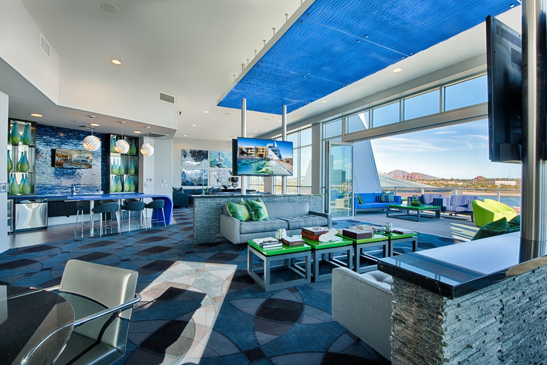 A living room with a blue ceiling and a flat screen tv.