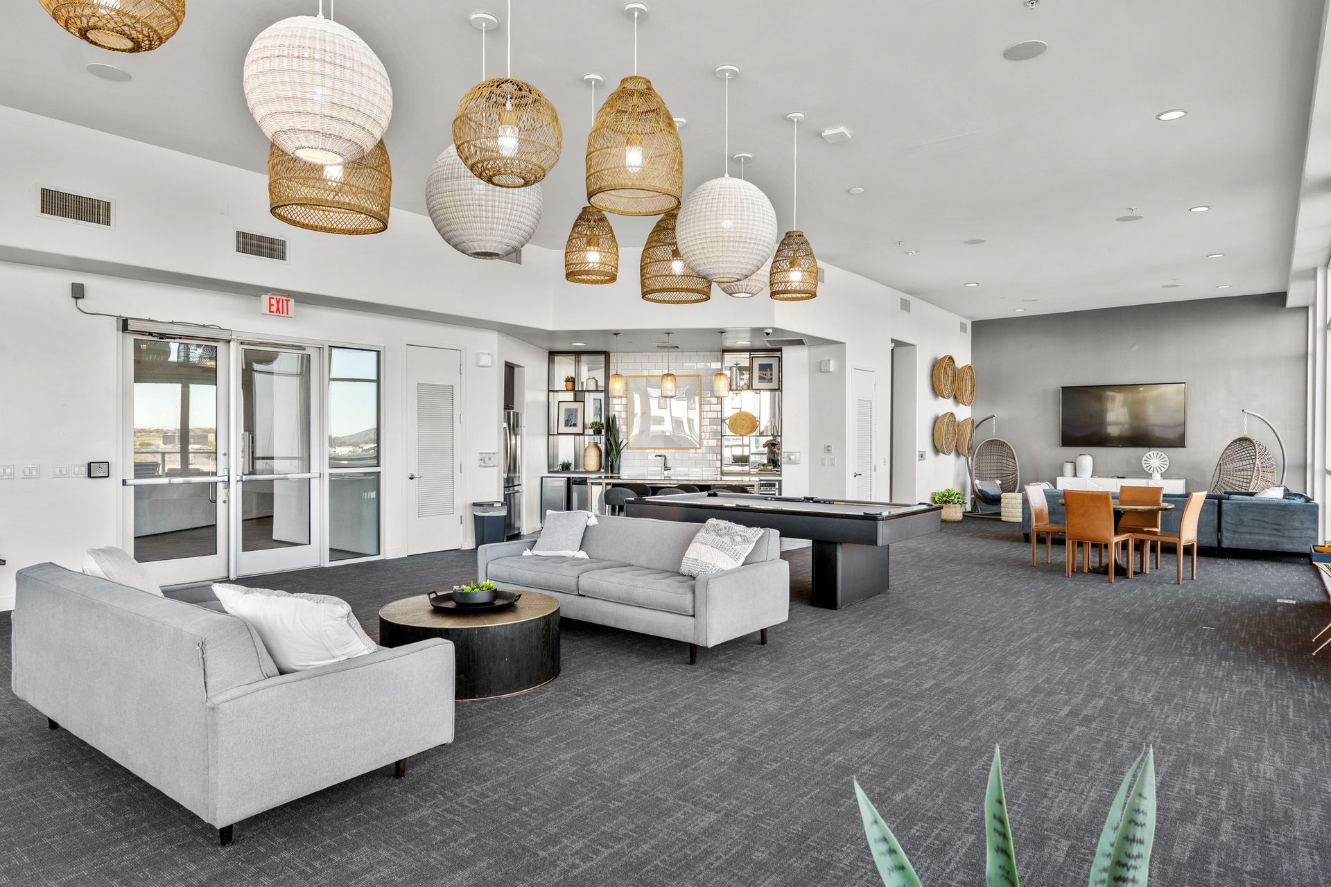 Clubhouse filled with furniture and a pool table.