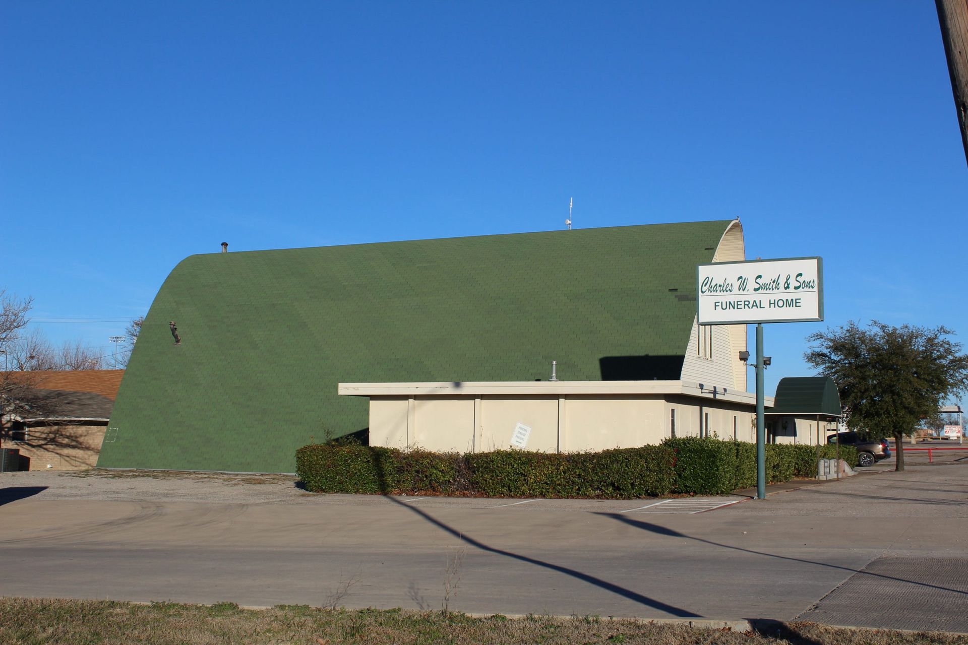 A building with a green roof and a sign that says ' eagle ' on it